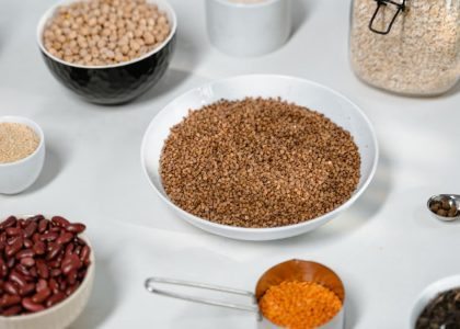 A collection of grains and legumes in various bowls and jars, perfect for culinary inspiration.